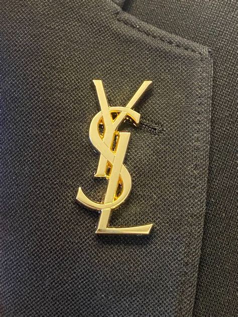 ysl lapel pin.